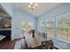 Eat-in dining area with natural light, rustic table, and backyard access at 7332 Newsome Sw Ct, Concord, NC 28025