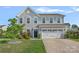 Charming two-story home features a well-maintained front yard, two-car garage, and inviting curb appeal at 7332 Newsome Sw Ct, Concord, NC 28025
