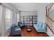 Inviting living room with hardwood floors, ample shelving, and comfortable seating for relaxation at 7332 Newsome Sw Ct, Concord, NC 28025
