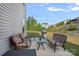 Outdoor patio with string lights, a grill, and comfortable seating, perfect for relaxing and entertaining at 7332 Newsome Sw Ct, Concord, NC 28025