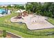 The community playground features slides, swings, and climbing structures, perfect for outdoor fun at 7332 Newsome Sw Ct, Concord, NC 28025