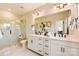 Modern bathroom featuring a double vanity, a large mirror, and a glass-enclosed shower with marble-style tile at 739 Hoke Ln, Davidson, NC 28036