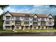New construction townhome featuring a sophisticated mix of white and brick facade at 739 Hoke Ln, Davidson, NC 28036