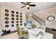 A home office with a white desk, record albums as decor, and stairs leading to another floor at 739 Hoke Ln, Davidson, NC 28036