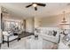 A spacious living room flows into the open kitchen that includes a modern sofa, white walls, and wood flooring at 739 Hoke Ln, Davidson, NC 28036