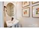 Well-lit bathroom with a modern sink, updated fixtures, and decorative wall art at 743 Hoke Ln, Davidson, NC 28036