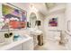 Well-lit bathroom with a modern sink, accessible features, and colorful artwork at 743 Hoke Ln, Davidson, NC 28036