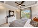 Bright bedroom featuring a modern ceiling fan and natural light streaming through the large windows at 743 Hoke Ln, Davidson, NC 28036