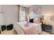 Tastefully decorated bedroom with a large mirror and plenty of natural light at 743 Hoke Ln, Davidson, NC 28036