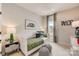 Nicely decorated bedroom with accent wallpaper, comfortable bed, and matching lamps at 743 Hoke Ln, Davidson, NC 28036