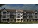 Exterior view of newly constructed townhomes with brick and siding, showcasing the architectural style and design at 743 Hoke Ln, Davidson, NC 28036