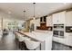 Open-concept kitchen features a large island with seating and modern appliances at 743 Hoke Ln, Davidson, NC 28036