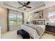 Spacious main bedroom with a decorative ceiling, large windows, and a modern design at 743 Hoke Ln, Davidson, NC 28036