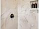 Close up of shower with white marble tiling and stylish black fixtures at 743 Hoke Ln, Davidson, NC 28036