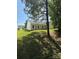 The property features a spacious green backyard, offering plenty of room for outdoor activities and relaxation at 8708 Goldfields Dr, Charlotte, NC 28227