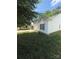 Well-maintained home showcasing white vinyl siding, a charming window with shutters, and a well-kept lawn at 8708 Goldfields Dr, Charlotte, NC 28227