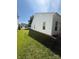 Lush green side yard with well-maintained lawn, providing a serene and inviting outdoor space at 8708 Goldfields Dr, Charlotte, NC 28227