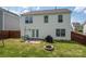 Home exterior with yard, patio, fence, and basketball hoop at 937 Anchor Ne Way, Kannapolis, NC 28083
