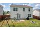 Back exterior featuring fenced yard, patio, swing set, and basketball hoop at 937 Anchor Ne Way, Kannapolis, NC 28083