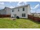 View of the home's back exterior with a patio and fenced yard at 937 Anchor Ne Way, Kannapolis, NC 28083