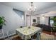Open dining room featuring a table with floral tablecloth and staircase to 2nd floor at 937 Anchor Ne Way, Kannapolis, NC 28083