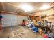 Spacious garage with concrete floor and two car door at 937 Anchor Ne Way, Kannapolis, NC 28083