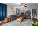 Open living room with hardwood floors, area rug, and ceiling fan at 937 Anchor Ne Way, Kannapolis, NC 28083