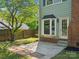Cozy backyard patio with brick accents, providing a comfortable space for outdoor relaxation and entertaining at 9430 Peckham Rye Rd, Mint Hill, NC 28227