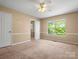 Bedroom with carpet and a window overlooking the trees at 9430 Peckham Rye Rd, Mint Hill, NC 28227