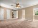 Expansive bedroom with neutral carpet, doors, and window at 9430 Peckham Rye Rd, Mint Hill, NC 28227