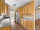 Kitchen area highlighting wood cabinets, modern appliances, and bright natural light at 9430 Peckham Rye Rd, Mint Hill, NC 28227