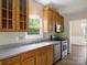 Spacious kitchen with wood cabinetry, stainless steel appliances, and tile backsplash at 9430 Peckham Rye Rd, Mint Hill, NC 28227