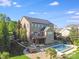 Beautiful backyard featuring a patio, pool, hot tub, and landscaped yard at 9433 Stonebridge Way, Mint Hill, NC 28227