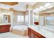 Bright bathroom featuring a soaking tub, shower, and dual vanities, offering a spa-like experience at 9433 Stonebridge Way, Mint Hill, NC 28227
