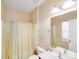 Bathroom featuring a single vanity, toilet and shower with curtain at 9433 Stonebridge Way, Mint Hill, NC 28227