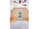 An empty carpeted room with a ceiling fan and window at 9433 Stonebridge Way, Mint Hill, NC 28227