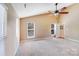 Spacious bedroom with neutral carpet, vaulted ceiling, ceiling fan, and three windows offering natural light at 9433 Stonebridge Way, Mint Hill, NC 28227