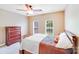 Bedroom features neutral walls, carpet, and a classic wood dresser and bed frame at 9433 Stonebridge Way, Mint Hill, NC 28227