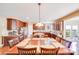 Spacious kitchen has stainless appliances, granite countertops, and large island with seating for the whole Gathering at 9433 Stonebridge Way, Mint Hill, NC 28227