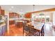 Gourmet kitchen boasts granite countertops, stainless steel appliances, an island with seating and hardwood floors at 9433 Stonebridge Way, Mint Hill, NC 28227