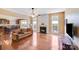Cozy living room features hardwood floors, a fireplace, and large windows that fill the space with natural light at 9433 Stonebridge Way, Mint Hill, NC 28227