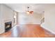 Bright living room with fireplace, hardwood floors, and an open floor plan at 9433 Stonebridge Way, Mint Hill, NC 28227