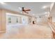 Spacious living area with fireplace, ceiling fan, and lots of natural light at 9433 Stonebridge Way, Mint Hill, NC 28227