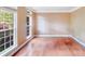Inviting living room with hardwood floors, large windows, and natural light at 9433 Stonebridge Way, Mint Hill, NC 28227