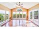 Sunroom featuring natural light from many windows and hardwood floors at 9433 Stonebridge Way, Mint Hill, NC 28227