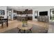 Bright living area with modern decor, an open layout, and a kitchen island with seating at 9527 Teamwork Nw St, Concord, NC 28027