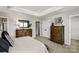 Relaxing bedroom with neutral colors, tray ceiling, and coordinated furnishings for a calming ambiance at 9527 Teamwork Nw St, Concord, NC 28027