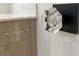 Close-up of bathroom door knob and vanity featuring a clear acrylic pull at 9596 Pacing Nw Ln, Concord, NC 28027