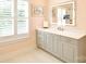 Bathroom featuring a vanity with grey cabinets, and gold hardware at 9596 Pacing Nw Ln, Concord, NC 28027