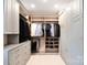Organized closet with ample storage, hanging rods, shelving, and custom cabinetry at 9596 Pacing Nw Ln, Concord, NC 28027